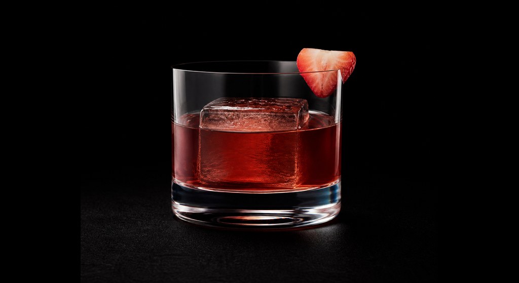 Please & Thank You cocktail on a dark studio background