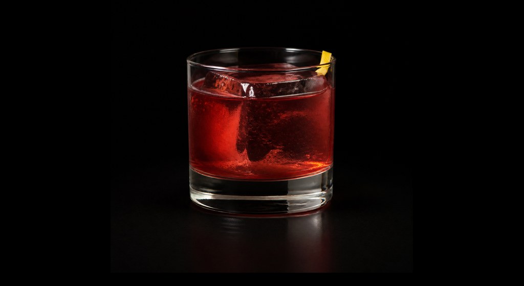 Ply & Pin cocktail on a dark studio background