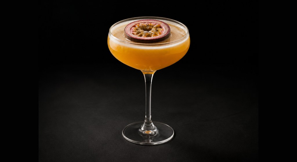 Pornstar Martini cocktail on a dark studio background