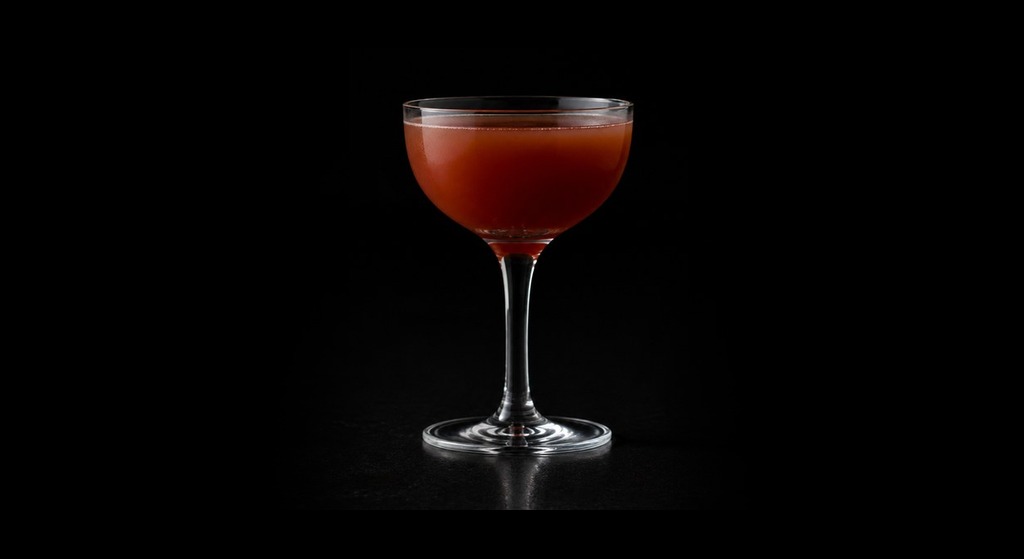Port of Spain cocktail on a dark studio background