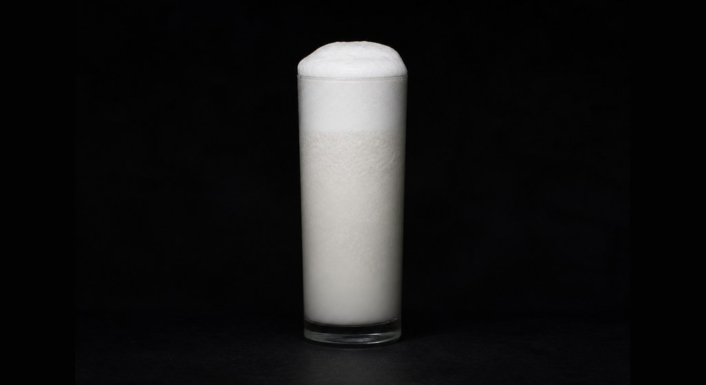 Ramos Fizz cocktail on a dark studio background
