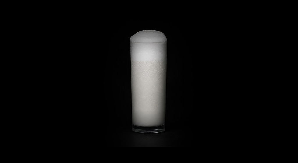 Ramos Fizz cocktail on a dark studio background