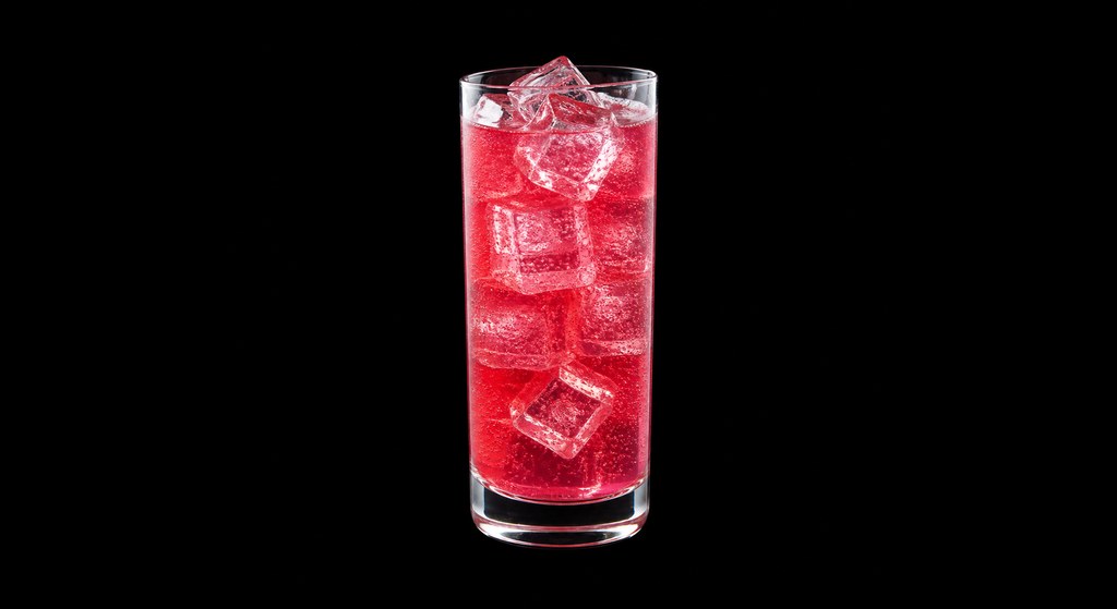 Raspberry Cooler cocktail on a dark studio background