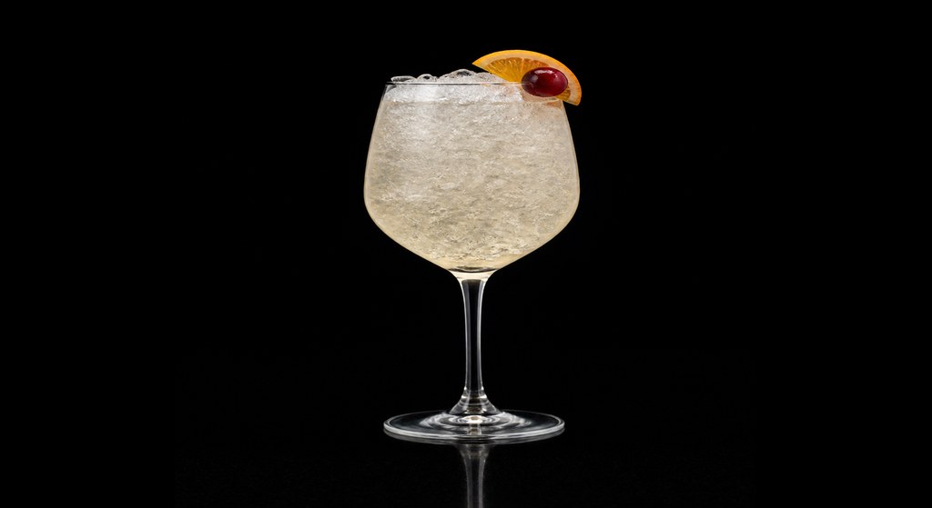 Rum Cobbler cocktail on a dark studio background