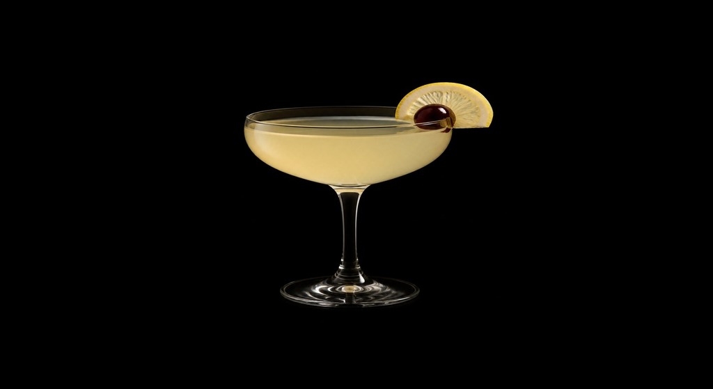 Rum Sour cocktail on a dark studio background