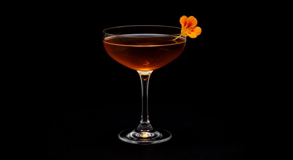 Saint Lucy Bracer cocktail on a dark studio background