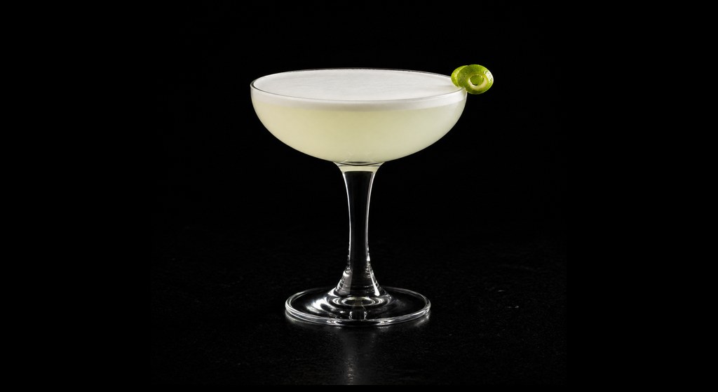 Sake Sour cocktail on a dark studio background