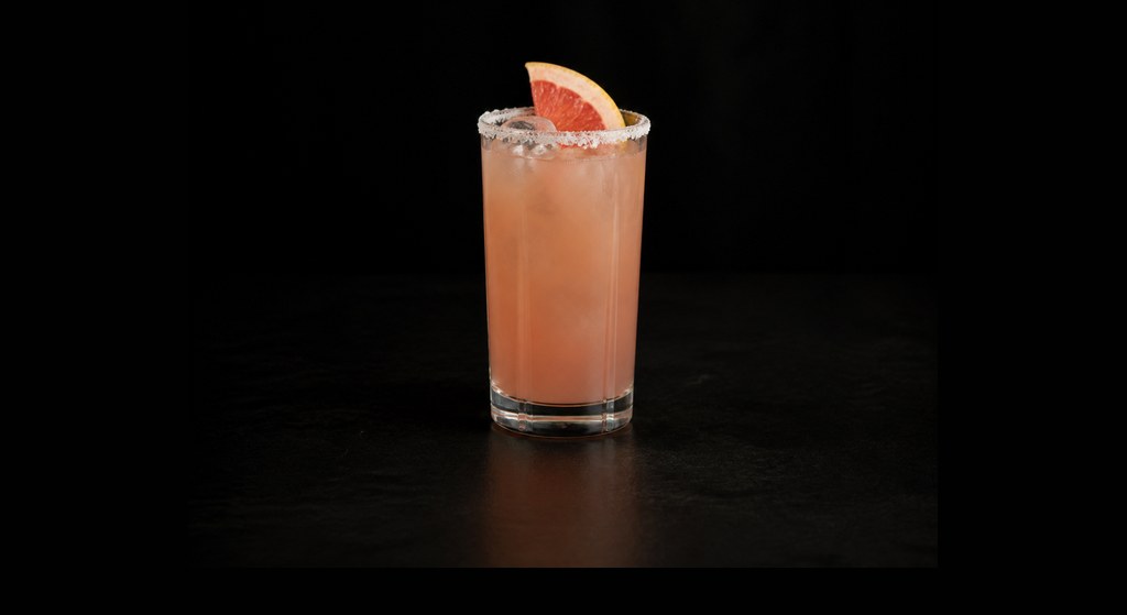 Salty Dog cocktail on a dark studio background