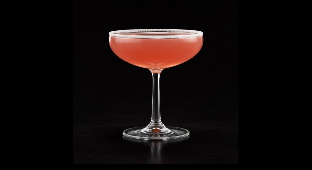 Santorini Sunset cocktail on a dark studio background