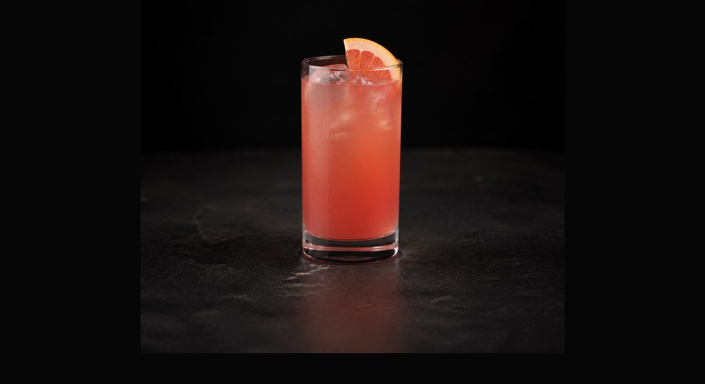 Sea Breeze cocktail on a dark studio background