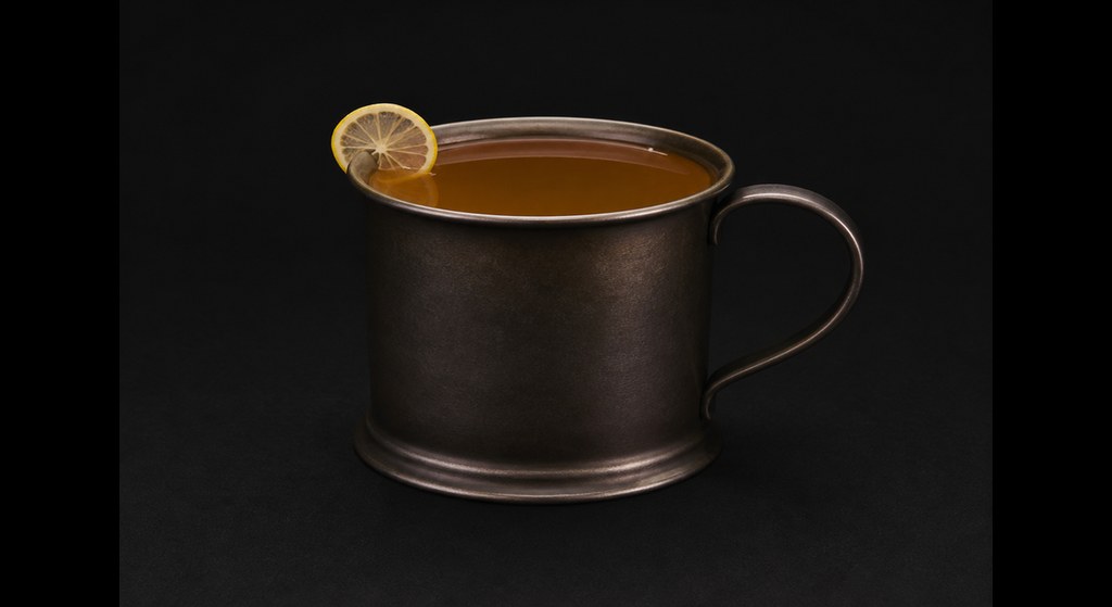 Serenity Now cocktail on a dark studio background