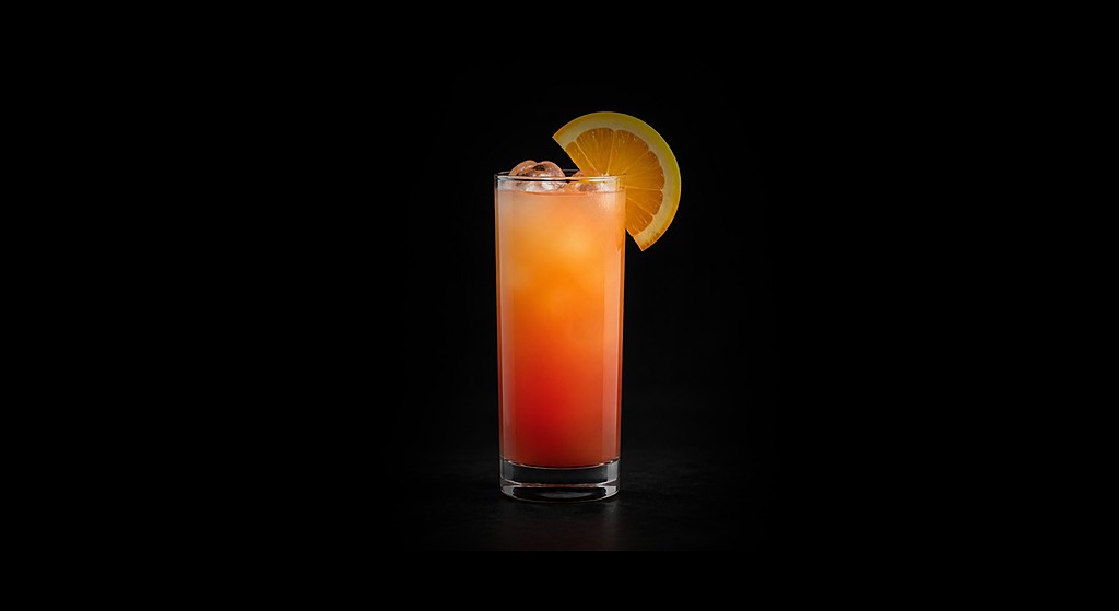 Sex on the Beach cocktail on a dark studio background