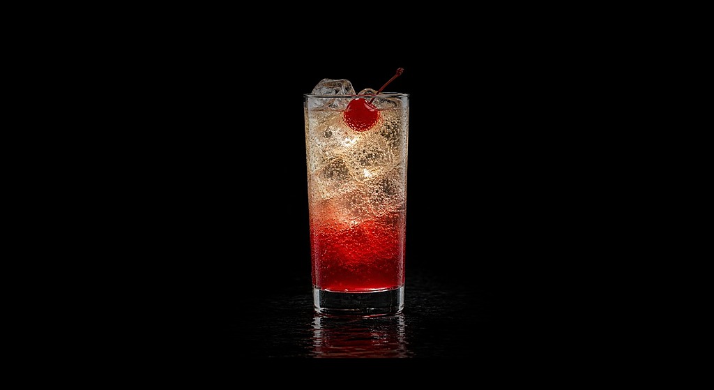 shirley temple cocktail on a black studio background