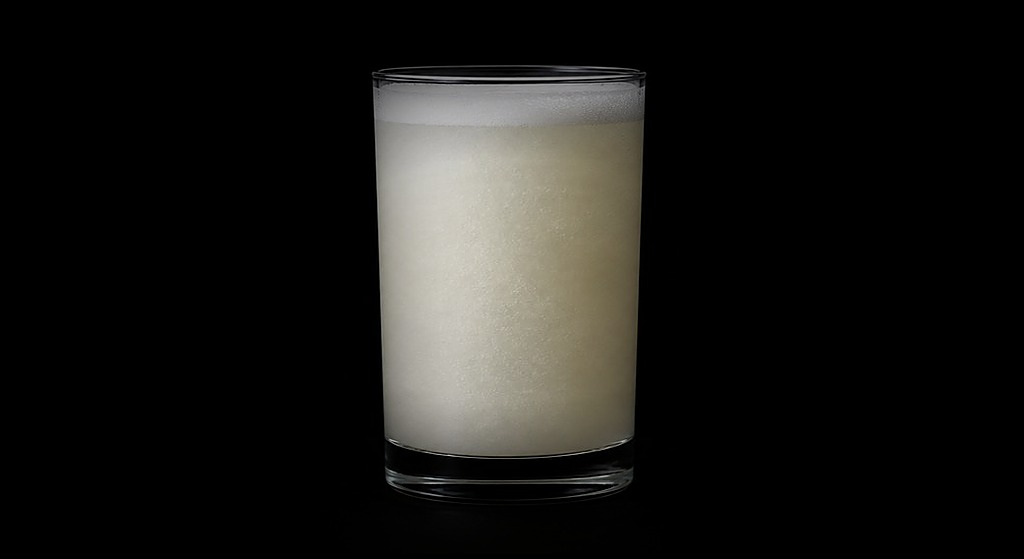 Silver Stallion Fizz cocktail on a dark studio background