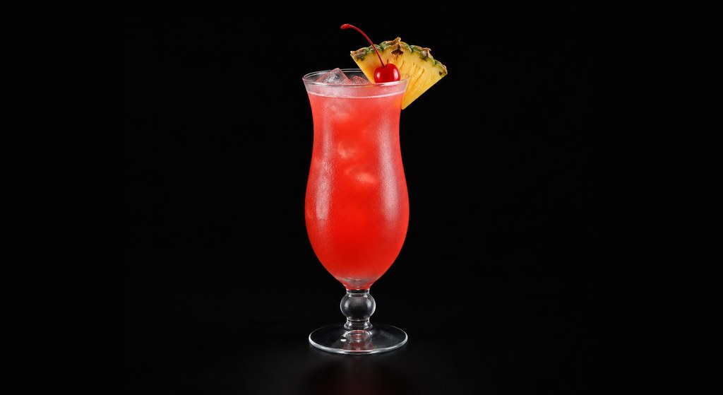 Singapore Sling cocktail on a dark studio background