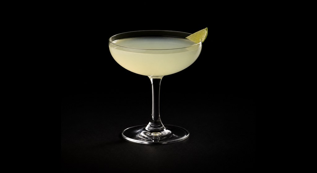 Single Village Fix cocktail on a dark studio background
