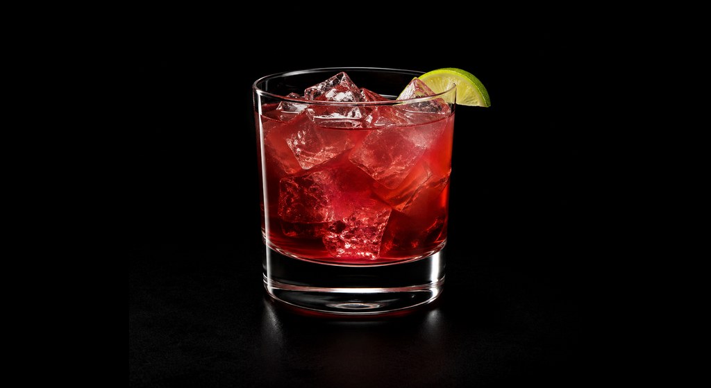 Sloe Tequila cocktail on a dark studio background