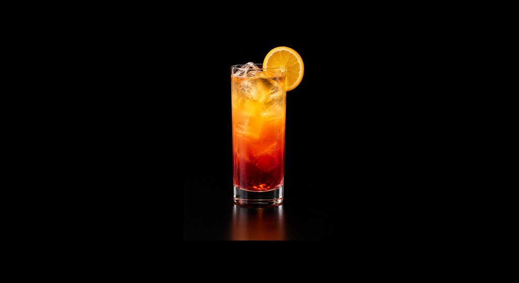 Slow Comfortable Screw Against the Wall cocktail on a dark studio background