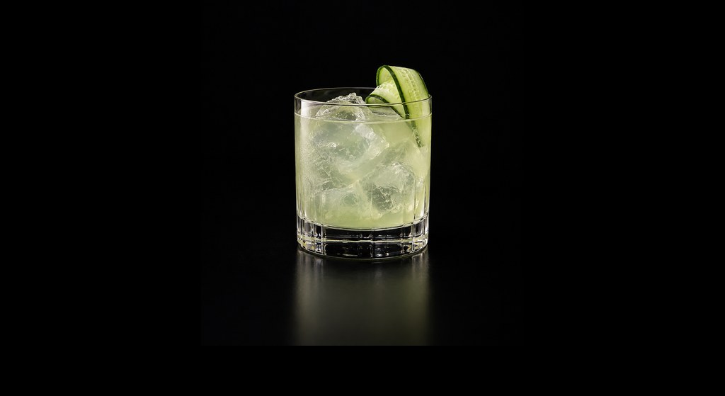 Sotol y Cucumber cocktail on a dark studio background