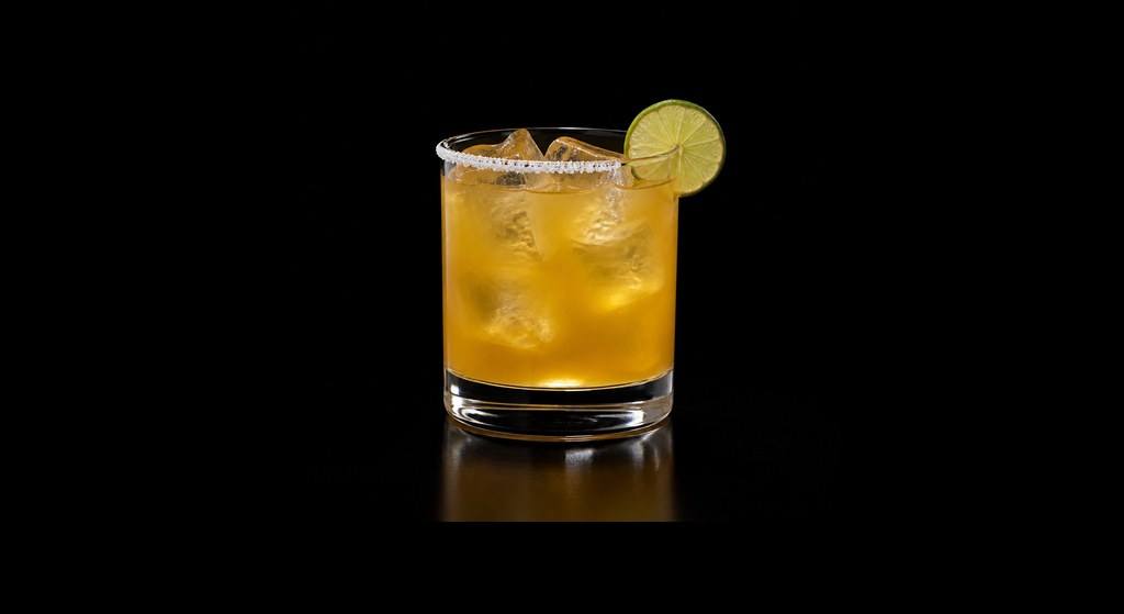 Spiced Mango Margarita cocktail on a dark studio background