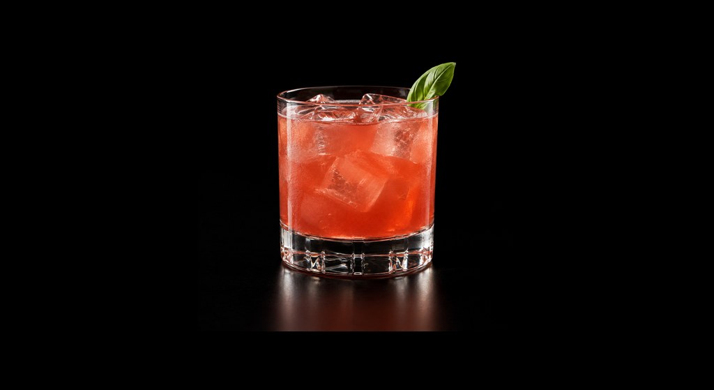 Strawberry & Basil Margarita cocktail on a dark studio background