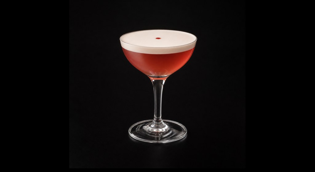 Strawberry Blonded cocktail on a dark studio background