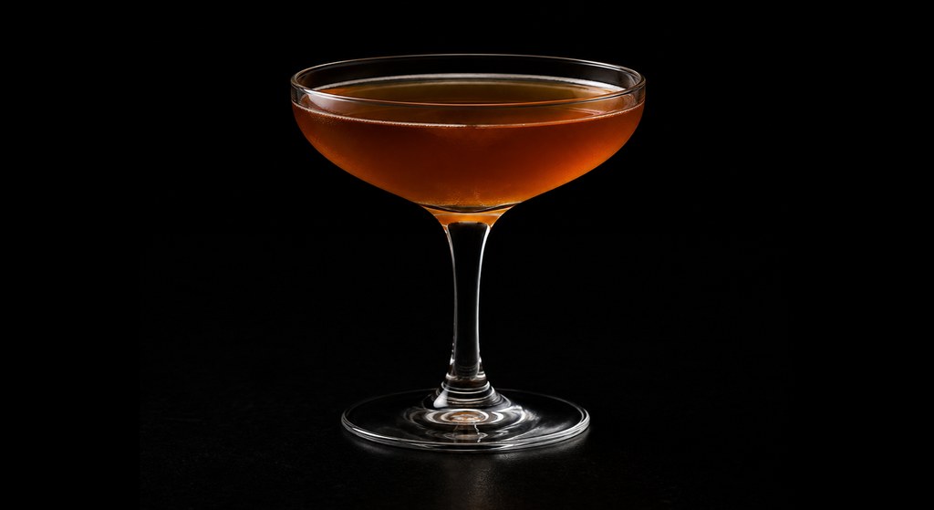 Sunset at Gowanus cocktail on a dark studio background