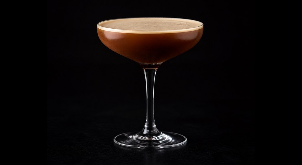 Tears of Gold cocktail on a dark studio background