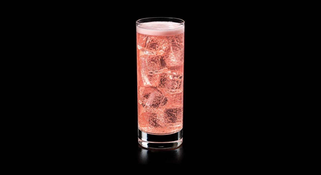 Tequila Fizz cocktail on a dark studio background