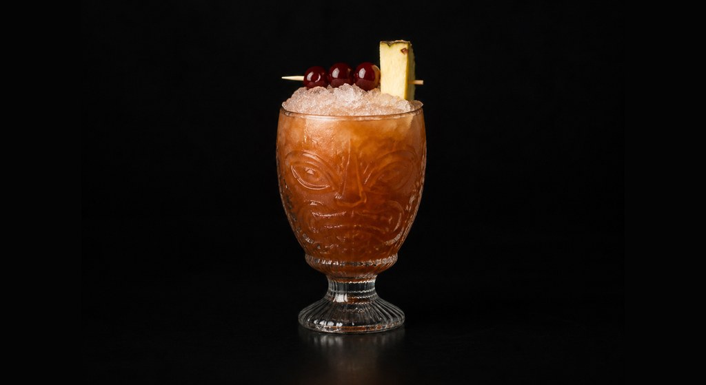 Three Dots and a Dash cocktail on a dark studio background