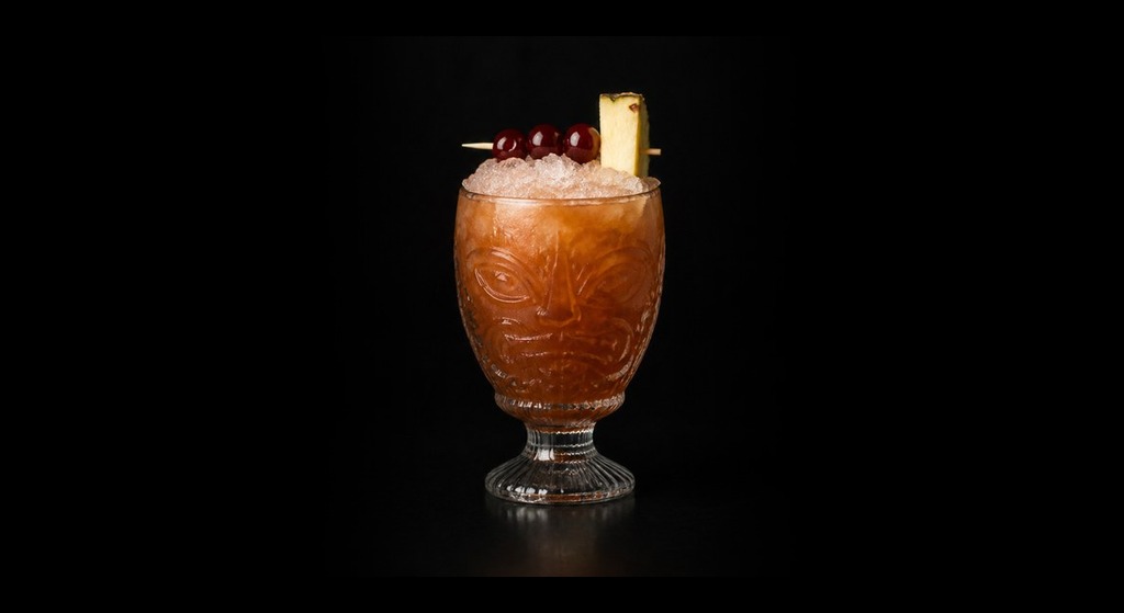 Three Dots and a Dash cocktail on a dark studio background