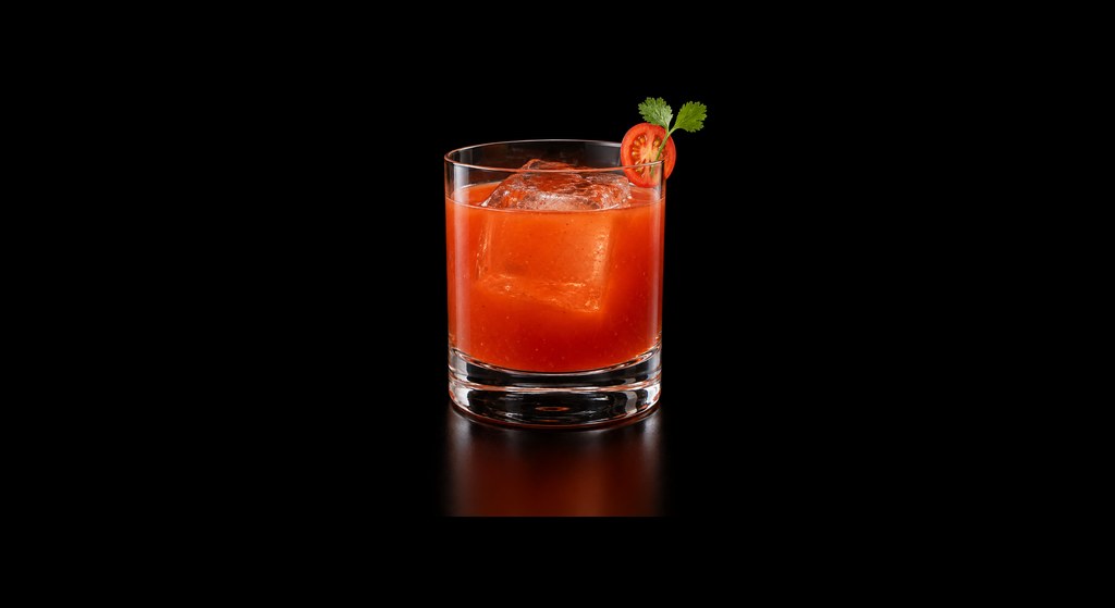 Tomato Tomatoe cocktail on a dark studio background