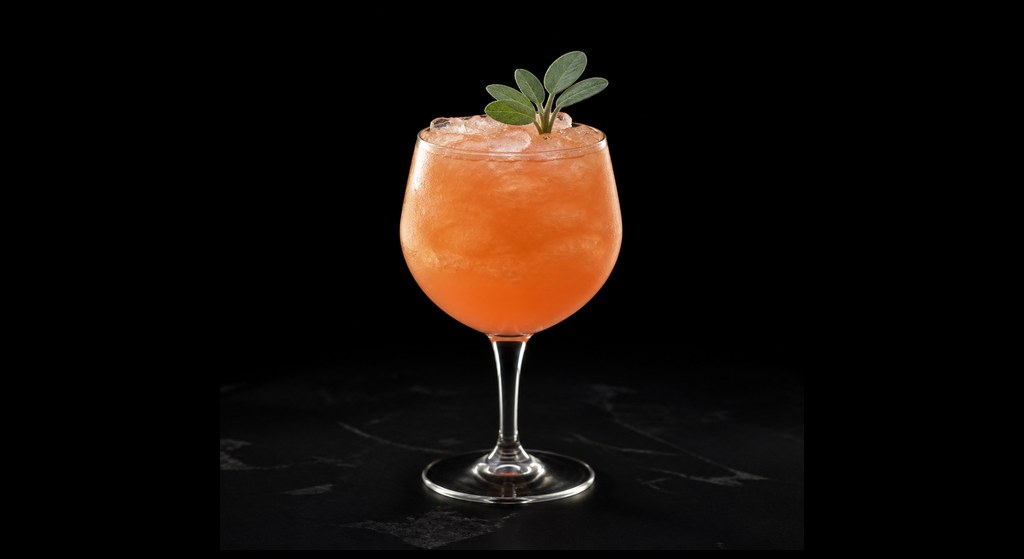 Tropic Like It's Hot cocktail on a dark studio background
