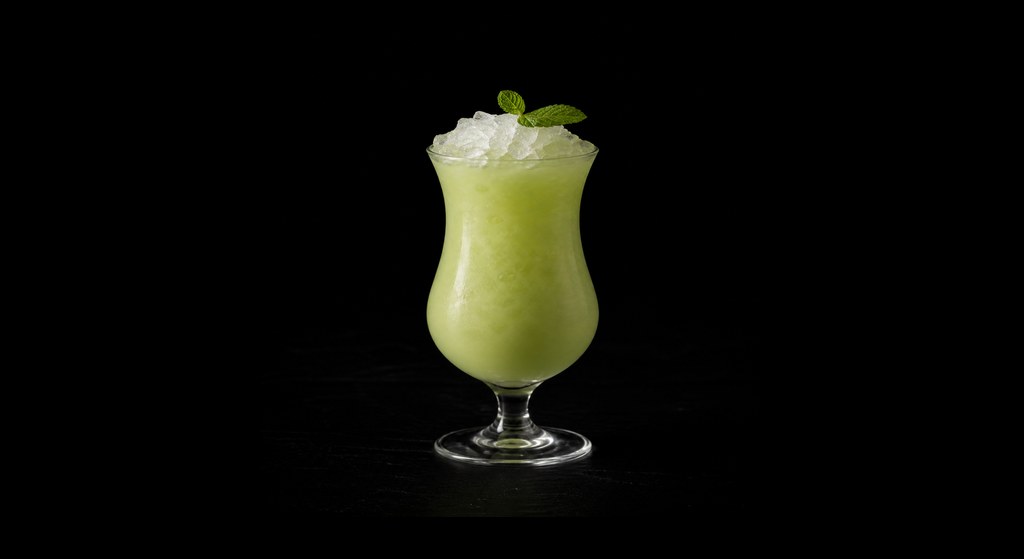 Turtle Power cocktail on a dark studio background
