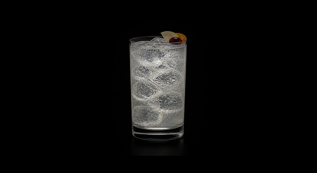 Vodka Collins cocktail on a dark studio background