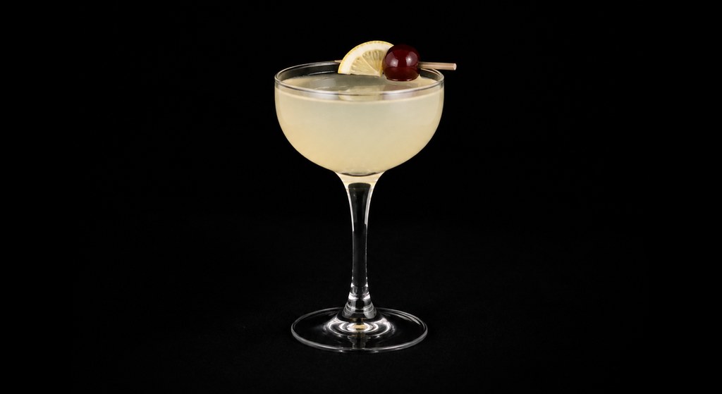 Vodka Sour cocktail on a dark studio background