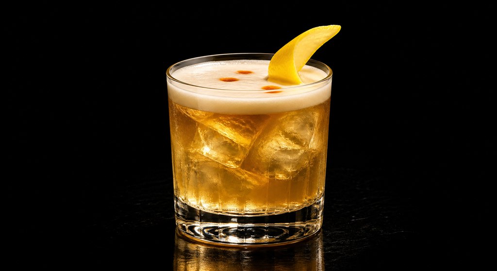 Whiskey Sour cocktail on a black background
