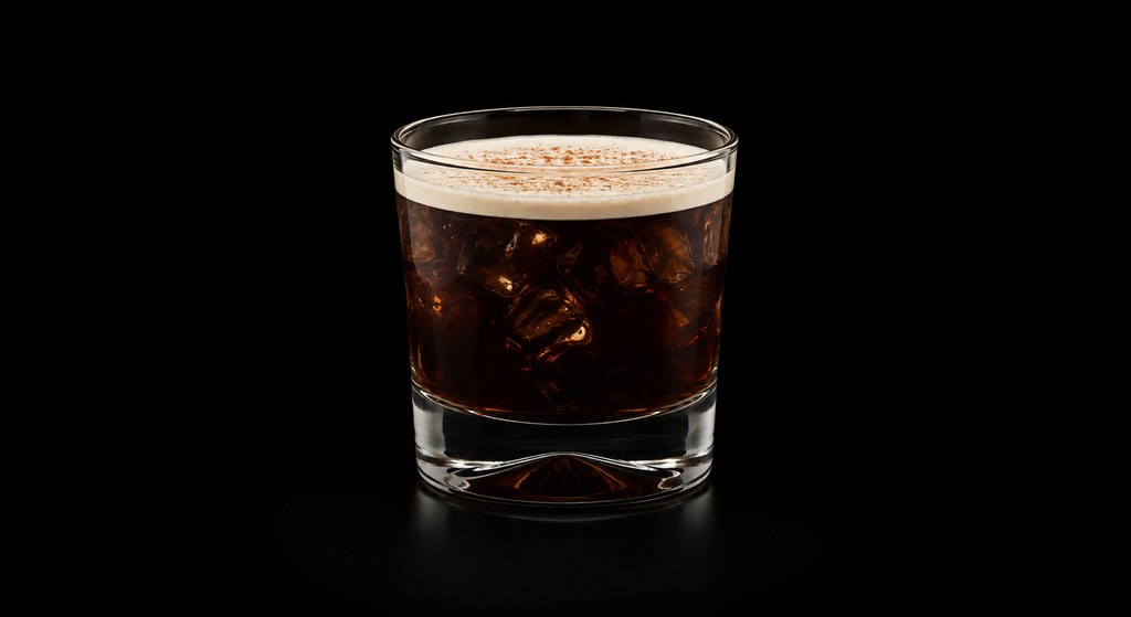 White Cuban cocktail on a dark studio background