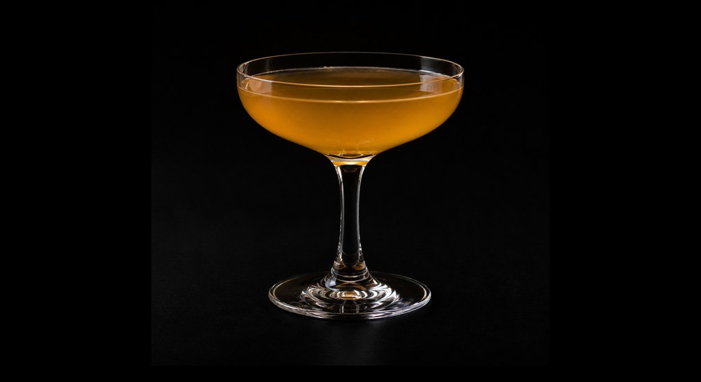 Widow's Word cocktail on a dark studio background