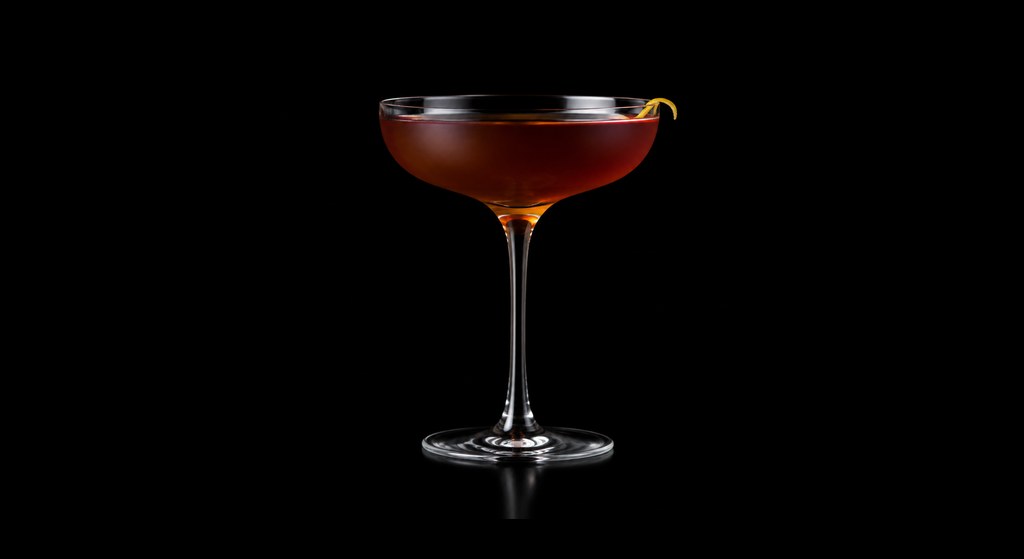 Yesterday, Today and Amaro cocktail on a dark studio background